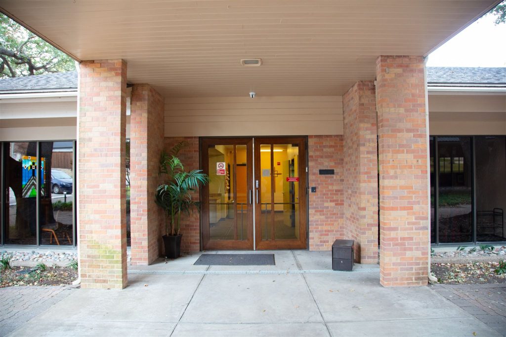 photo of glass doors leading in the education building